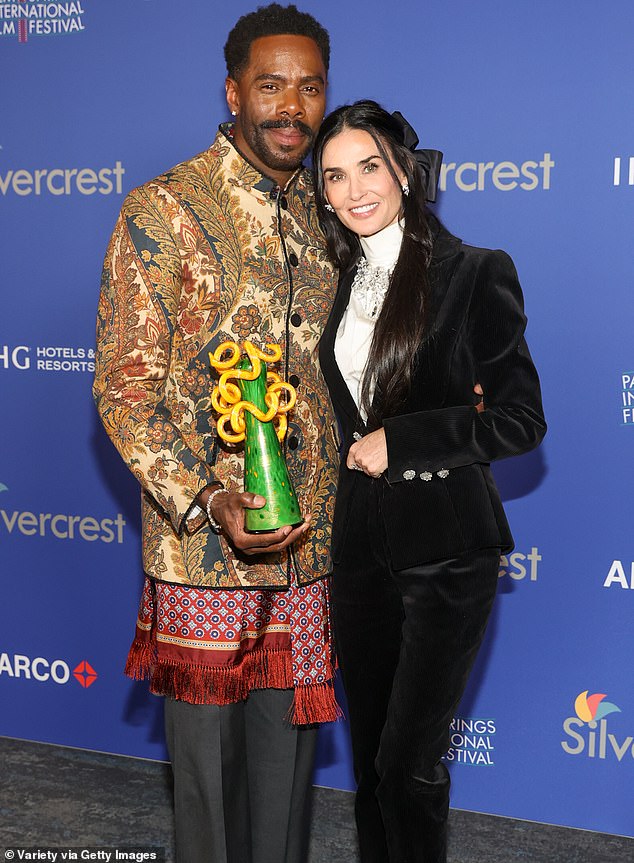 Moore and Colman Domingo were spotted taking a memorable photo together after she presented the award to the actor