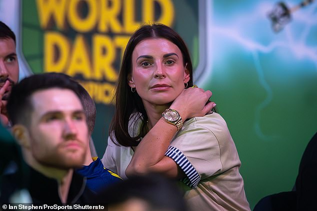 The I'm A Celebrity star opted for a chic beige T-shirt with a blue and white striped trim, with the stunner pairing her top with a trendy gold watch and simple gold earrings