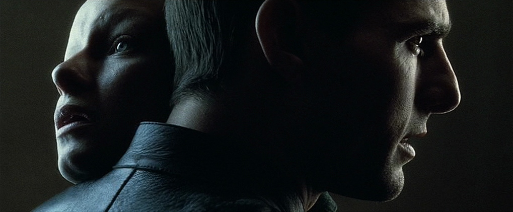 Tom Cruise's John Anderton holds up the female precog as they embrace and look in profile in different directions in Minority Report