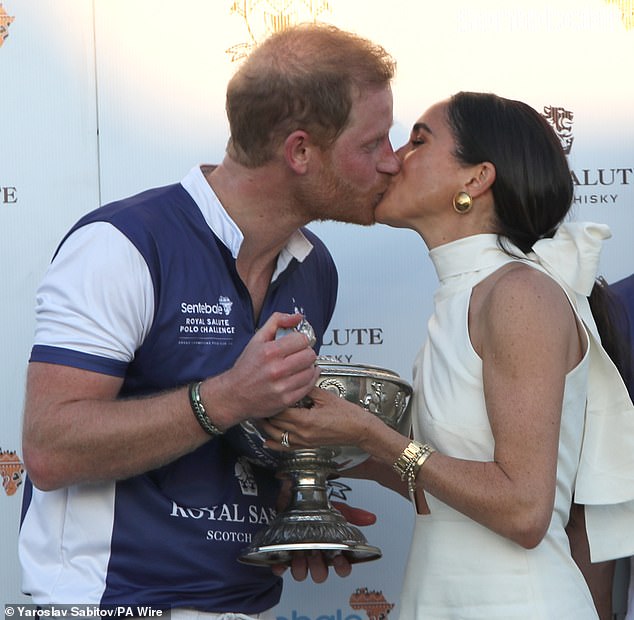 Meghan and Harry kiss at a polo event to raise money for his charity Sentebale