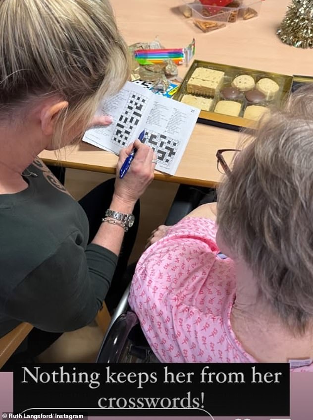 In another photo, the Loose Women star was seen with her blonde locks in a neat ponytail and dressed in a khaki top as she did a crossword with Joan.