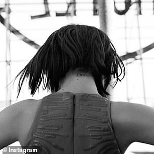 Selena Gomez has 'LXXVI', which means '1976', written in Roman numerals, on her neck