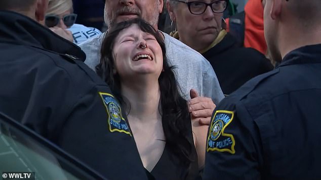 Brooke collapsed with emotion as they walked, even prompting tears from the officers who escorted them, and spoke at a memorial at the site.