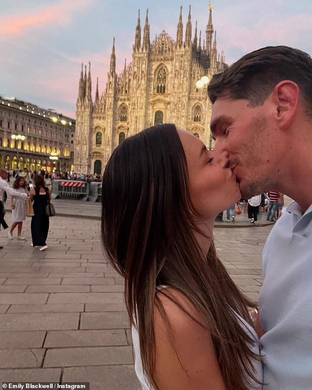 Emily also shared a photo of the couple enjoying a passionate hug outside Milan's cathedral