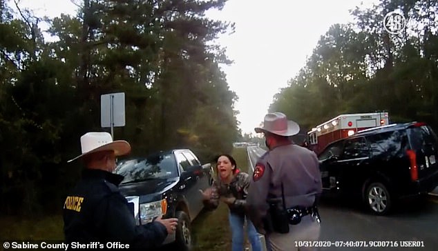 Darci Bass, Lewis' mother, is seen approaching officers and asking for details about her daughter