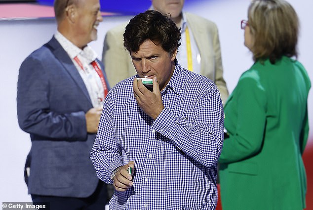 The Fox News host is seen with a pack of baggies as he prepares for the fourth day of the Republican National Convention at the Fiserv Forum on July 18, 2024 in Milwaukee