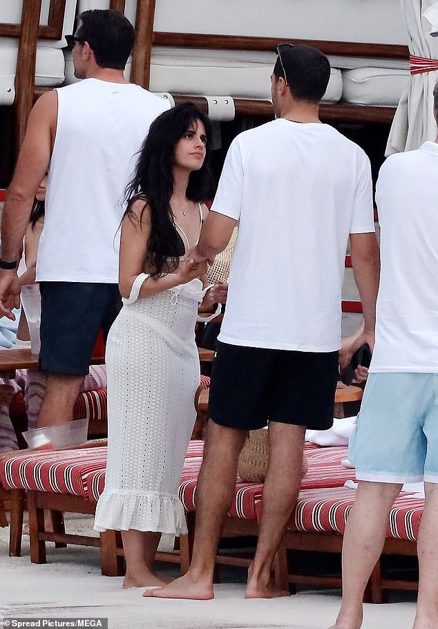 Before she entered the water, she wore a white, covering dress