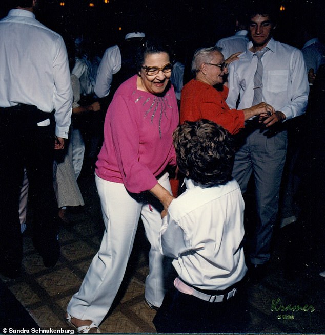 Lee dances with Joey, the family's first grandson, at Debbie's wedding