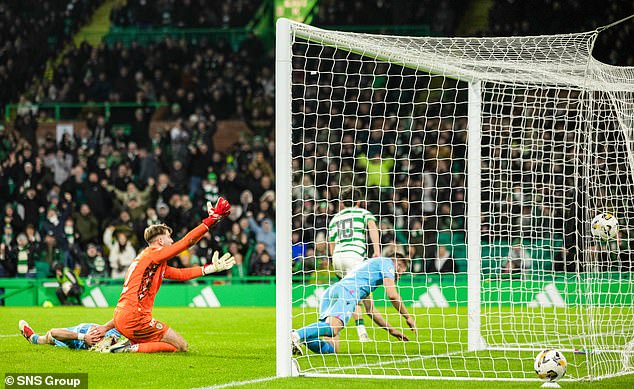 Celtic's top scorer drives off after scoring his second goal, much to Hemming's dismay