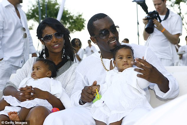 Diddy pictured with his partner Kim Porter and twin daughters D'Lila and Jessie in 2007