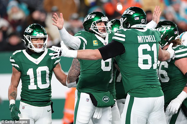 Rodgers celebrates with offensive lineman Max Mitchell after throwing his 500th career TD