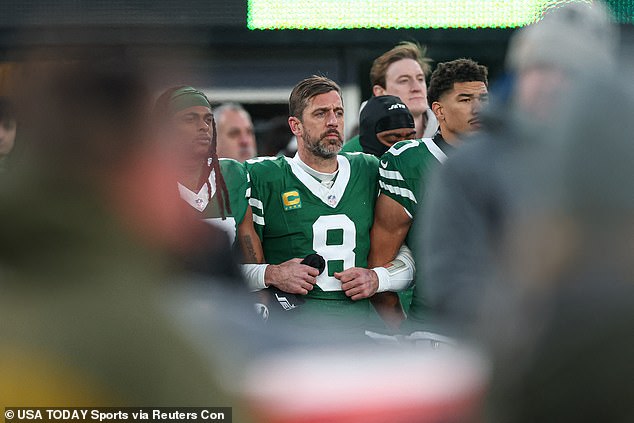 The 41-year-old linked arms with Adams and Allen Lazard during the national anthem