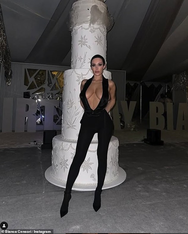 While Bianca was at her party, she sizzled in a barely-there black bodysuit ensemble that highlighted her ample cleavage as she posed in front of a cake that was bigger than her