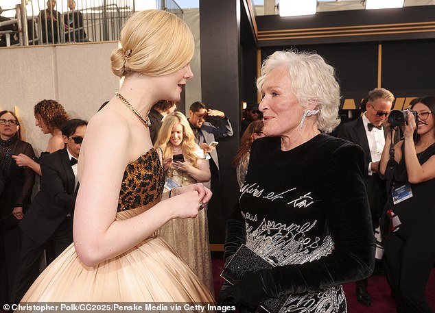 At 6 feet tall, Elle (née Mary) towered over the 77-year-old scene stealer from Deliverance, who she appeared to gush over on the red carpet