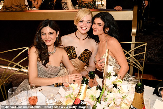 And with no more pressure, Fanning was able to hang out with her castmate Monica Barbaro (L) and Timothée's reality star girlfriend, Kylie Jenner (R)