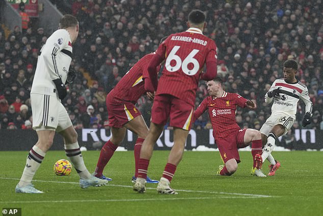 Amad Diallo (right) saved a point for Man United after scoring in the 80th minute at Anfield