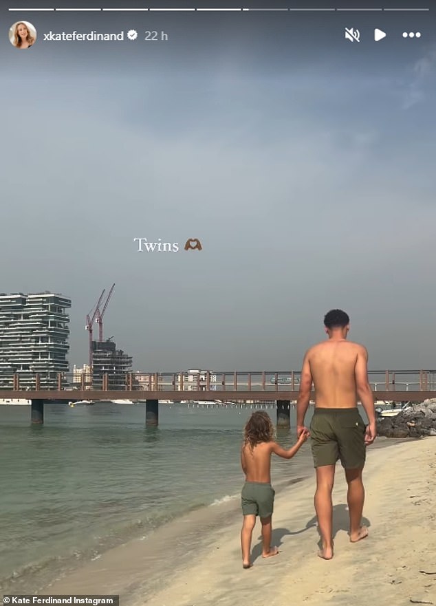 The youngster later held hands with his older brother as they walked along the sea