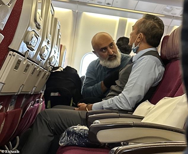 Arif (pictured left) prayed, sang and laughed before the plane departed Sydney that afternoon, and the crew moved 'concerned passengers' to other seats