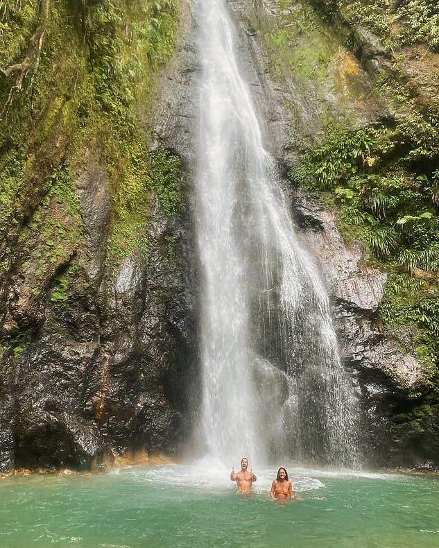 The DJ, 40, posted the rare joint photo of the pair taking a dip in the turquoise waters below Syndicate Falls on the Caribbean island of Dominica.