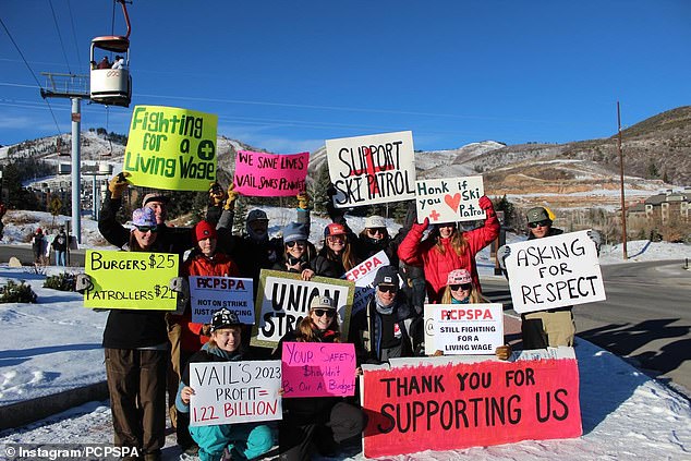 Distinctive ski patrollers with signs are depicted on the side of Park City Mountain