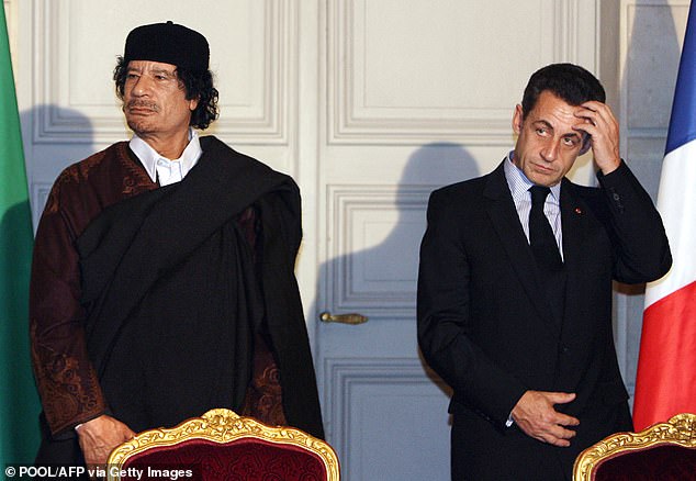 Nicolas Sarkozy and former Libyan dictator Moamer Gaddafi pictured during the signing of trade contracts worth 10 billion euros between the two countries, at the Elysée Palace in Paris on December 10, 2007