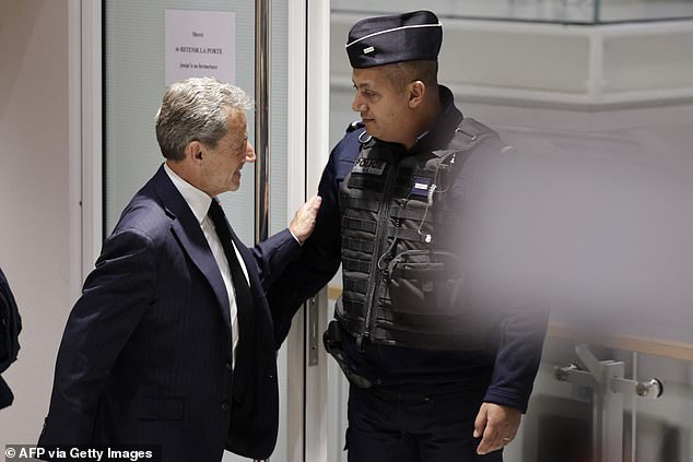 Former French President Nicolas Sarkozy leaves the courtroom at the Paris Courthouse in Paris during the opening hearing of his trial on January 6, 2025