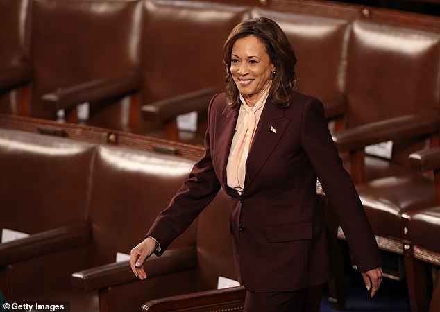 Vice President Kamala Harris smiles as she arrives in the House chamber to announce President-elect Donald Trump's election victory. Monday's count went smoothly, unlike four years ago, when it was interrupted by the violent attack on the Capitol