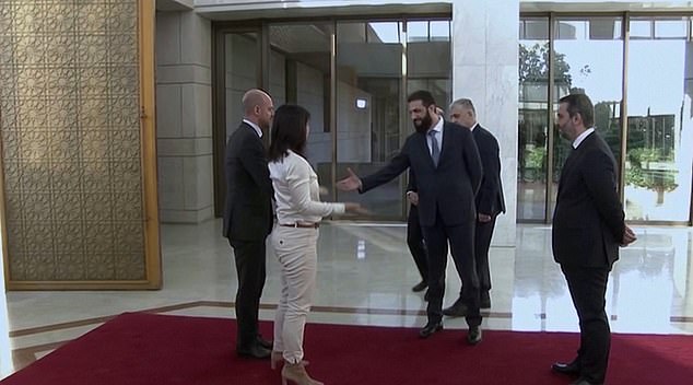 Abu Mohammed al-Jolani, a former jihadist, chose to shake hands with Annalena Baerbock during a rally in Damascus