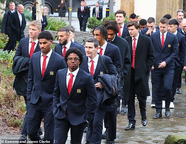 Manchester United players, including Marcus Rashford (second from left), wore club suits that day