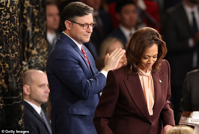 Harris pursed her lips and brushed her hair as she read Trump's vote totals