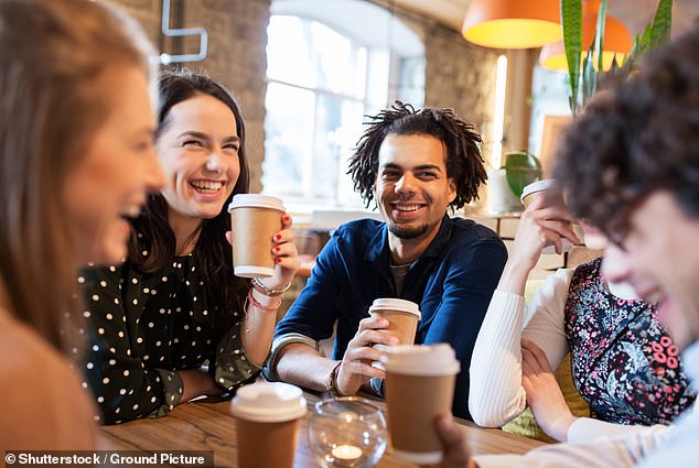 'Coffee badging' involves hybrid workers going to the office, drinking a cup of coffee and interacting with colleagues before going home early to work (stock image)