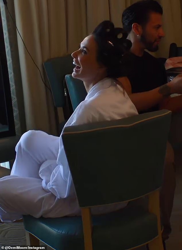 Demi was in good spirits, laughing and joking with her team ahead of the awards ceremony