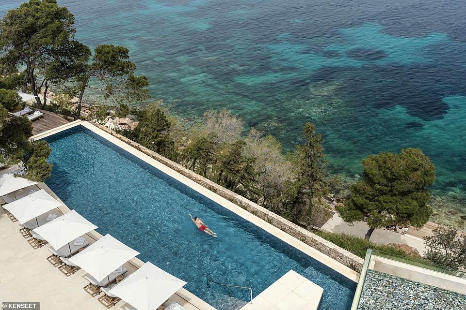 Water treat: Fiona and her family enjoy the hotel's 'perfect' olive tree-lined pool (above)