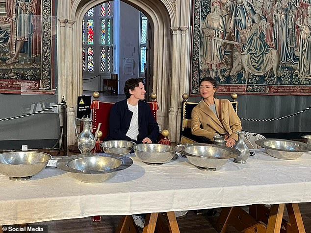 Like regular tourists, the couple posed for snapshots at a banquet table in the royal palace