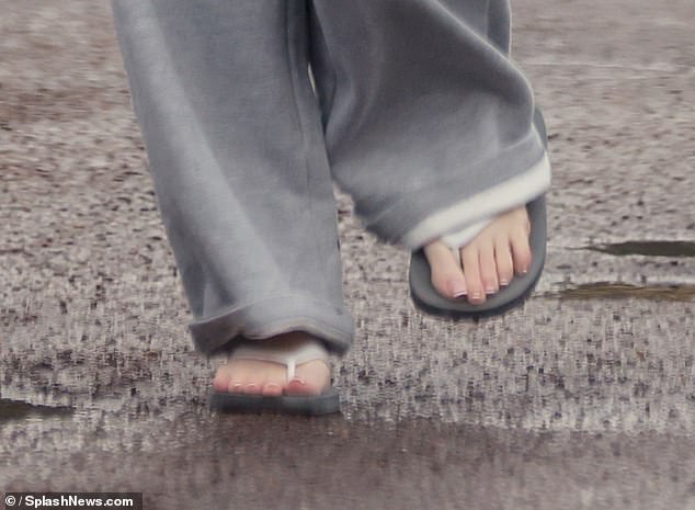 Maura braved the cold despite Britain's freezing temperatures and showed off her pedicured toes in a pair of slippers as she headed to her car