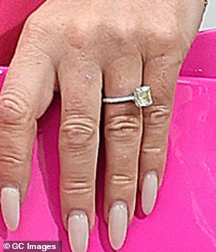 Amanda pictured in 2024 wearing her first engagement ring from 2008