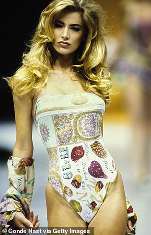 In a swimsuit from the Versace RTW Runway collection of spring 1992