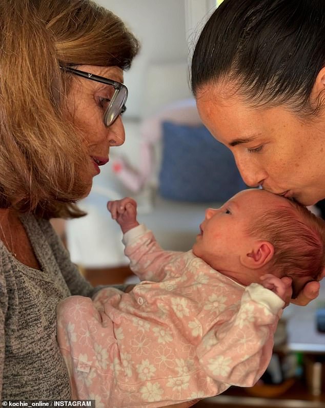 He confirmed that Georgie and her husband Alex Merkel have welcomed a baby girl named Heidi and shared a photo of his wife Libby meeting the little one (pictured)