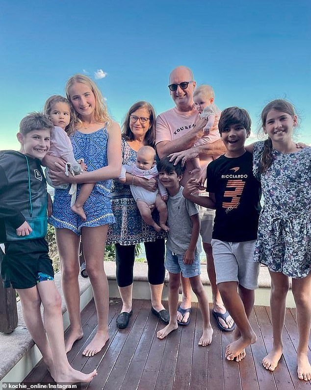 David and his wife Libby are pictured with their grandchildren