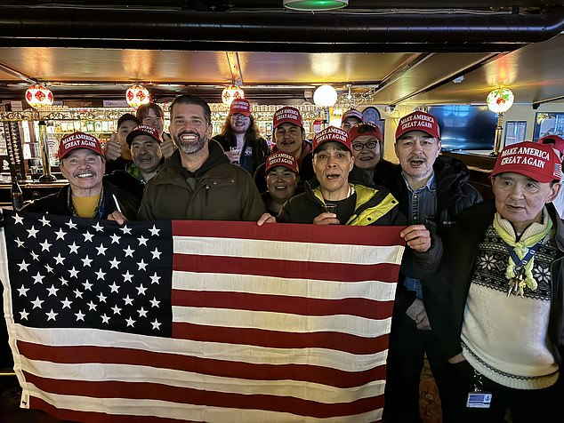 Don Jr. had her photo taken with locals in Nuuk, Greenland, on Tuesday, all wearing red Make America Great Again hats