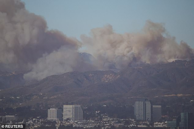 The evacuation notice has caused a gridlock on Sunset Boulevard as LA residents flee, leaving their homes behind as the 200-acre fire quickly scorches the ground around them.