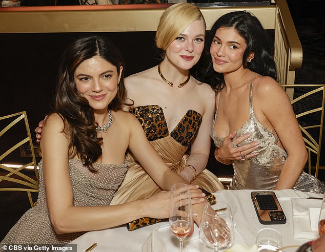 While at the event at The Beverly Hilton, the lip kit mogul was able to mingle with Timothee's A Complete Unknown co-stars Monica Barbaro (left) and Elle Fanning (center)