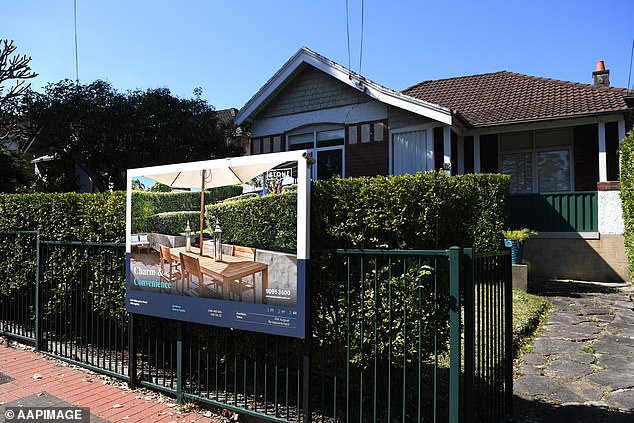 Sydney and Melbourne have about 40 percent of the country's housing stock. The photo shows a house for sale in Sydney