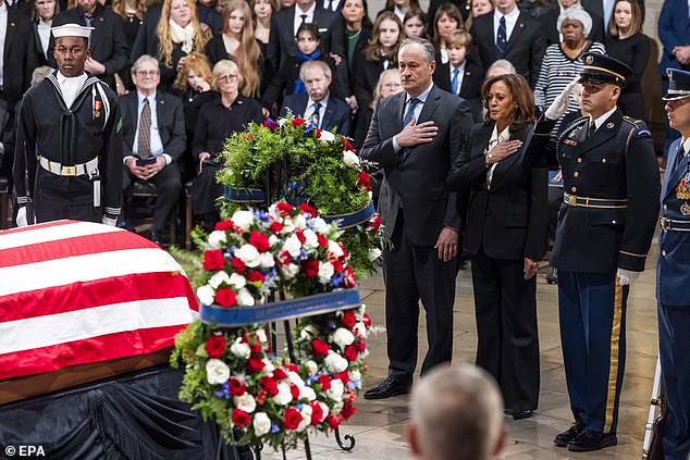 Vice President Kamala Harris and Second Gentleman Doug Emhoff pay their respects to former President Jimmy Carter in the Capitol Rotunda