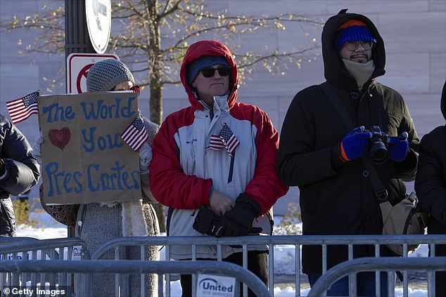 People watch as former President Jimmy Carter's casket moves through Washington toward the U.S. Capitol on Jan. 7