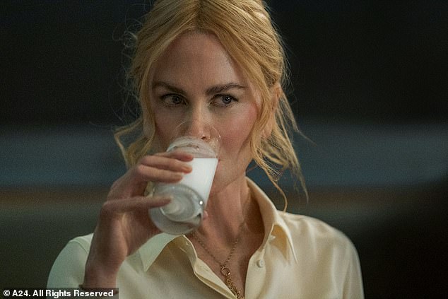 In the now infamous scene, Nicole's character Romy drinks an entire glass of milk in a bar (pictured) during a flirty conversation with her younger intern Samuel (Harris Dickinson)