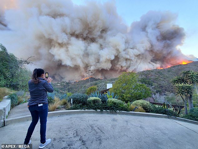 The Hills star, who wore a black graphic T-shirt, olive shorts and black sneakers, rubbed his eyes at one point, possibly from irritating smoke or flying debris