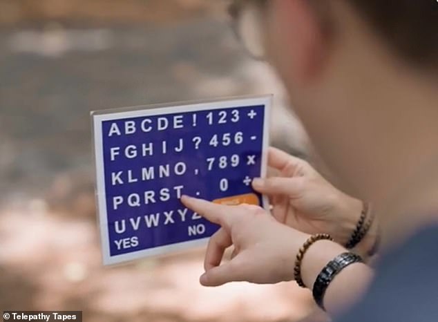 The girl is asked to use a letter board (photo) to spell out the number or word her mother is thinking of and say the correct number or word each time