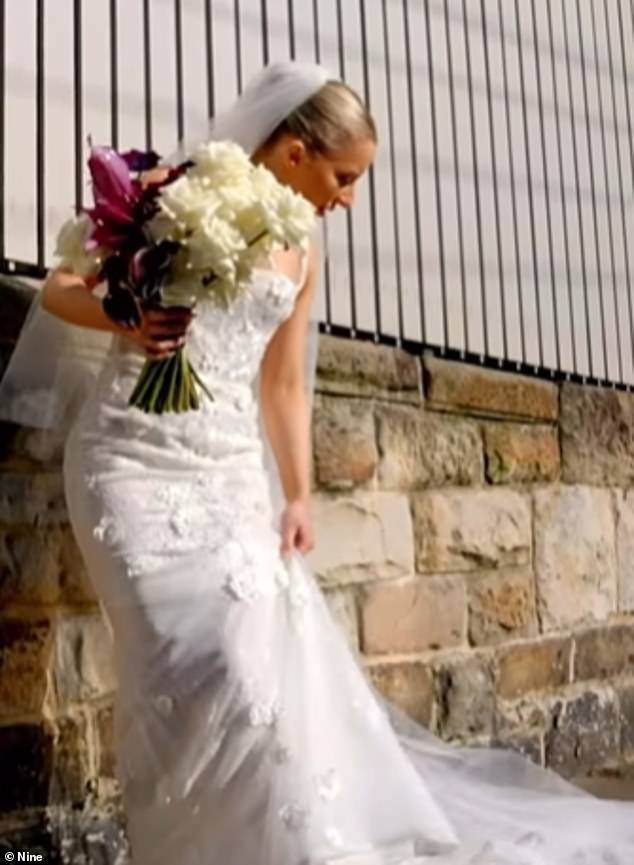 In another shot from the clip, Jamie walked down a sidewalk in her tight wedding dress, but tore the hem when it caught on the ground.