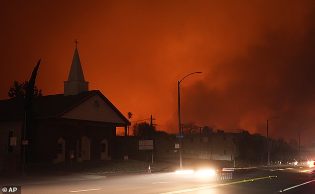 A wildfire raged Tuesday in the hills near Eaton Canyon behind Pasadena's Living Rock Church